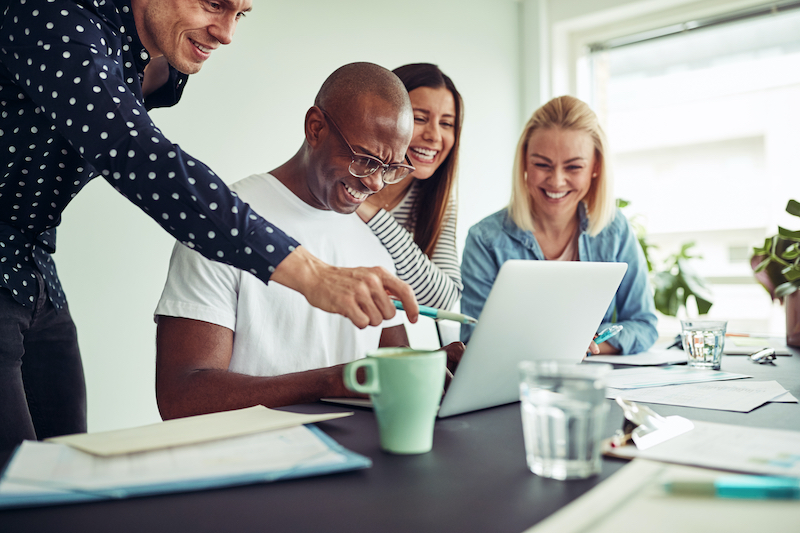 Team Working On Laptop
